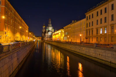 Illuminated buildings in city at night