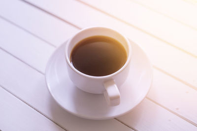 High angle view of coffee cup on table