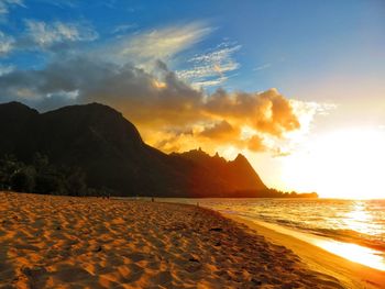 Scenic view of beach against sky during sunset