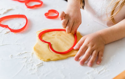 High angle view of woman preparing food on table