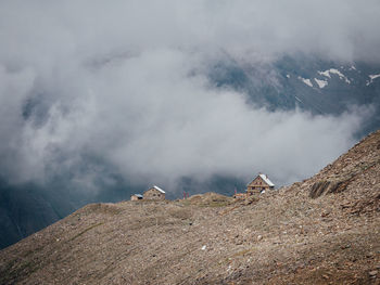 Scenic view of landscape against cloudy sky