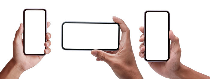 Low angle view of smart phone against white background