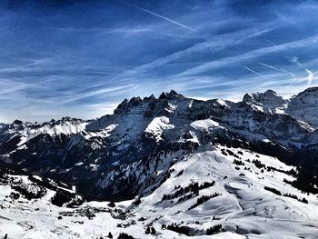 Scenic view of snow covered mountains against  sky