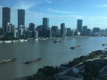 Scenic view of sea and buildings against sky