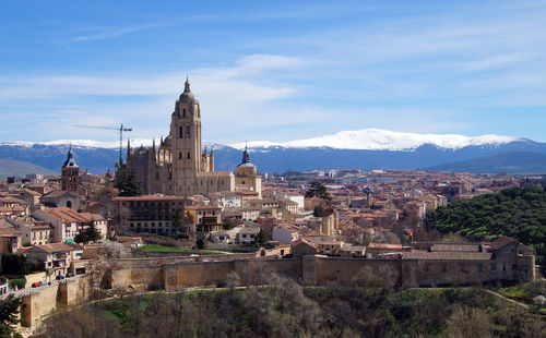 High angle view of buildings in city against sky