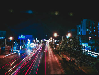 High angle view of light trails on city street at night