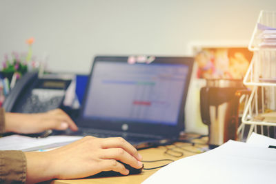 Close-up of man using laptop