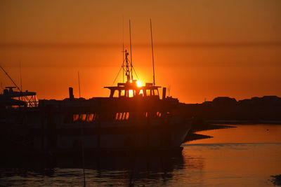 Silhouette of marina at sunset