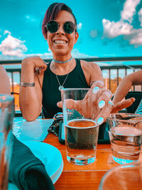 Portrait of a smiling woman holding drink