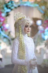 Beautiful bride looking away at wedding ceremony