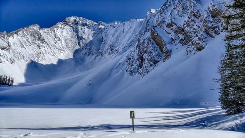 Scenic view of snowcapped mountains against sky