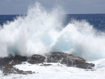 Waves splashing on rocks