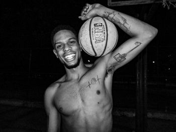 Portrait of young man standing at home