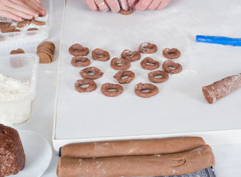 Cropped image of father and son making christmas cookies