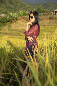 Woman standing on field