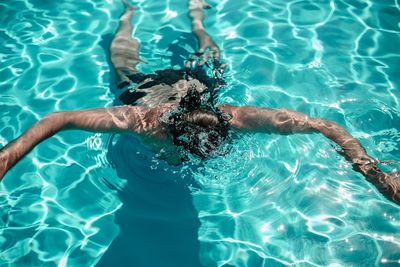 High angle view of man in swimming in pool