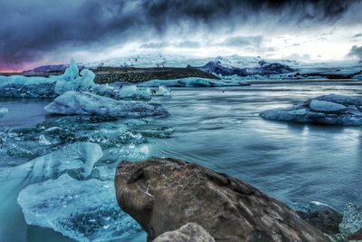 Scenic view of frozen sea against sky