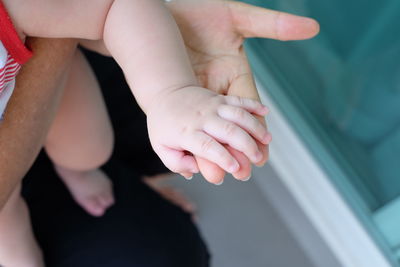 High angle view of people holding hands