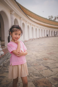 Sweet pose little girl in the temple