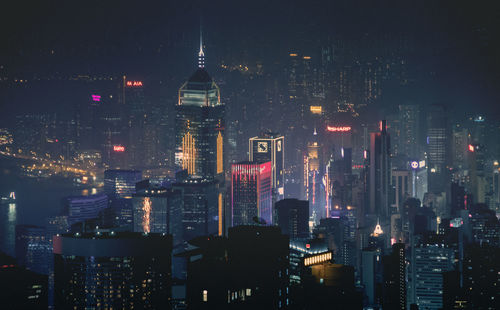 High angle view of illuminated cityscape with central plaza