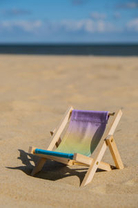Empty chairs on beach