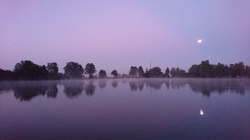 Reflection of trees in calm lake