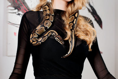 Midsection of woman holding hands