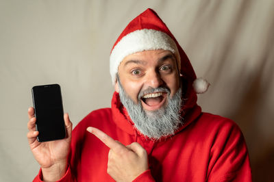 Portrait of young man using mobile phone