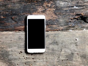 Close-up of smart phone on table