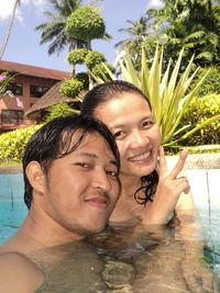 Portrait of a smiling young man swimming pool