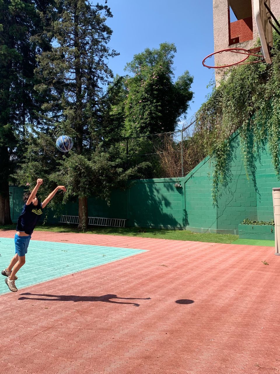 MAN JUMPING IN SWIMMING POOL
