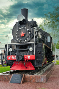 Train on railroad track against sky