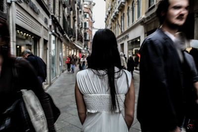 People walking in front of buildings