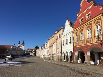 View of road along buildings