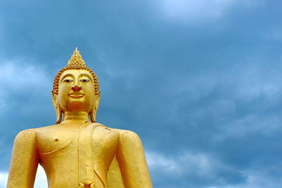 Low angle view of statue against sky