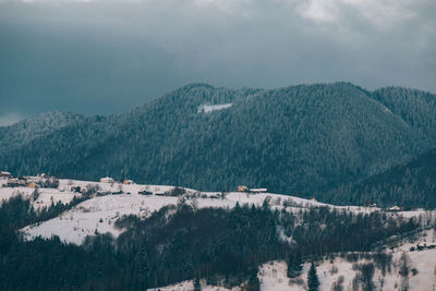 Scenic view of mountains against sky during winter