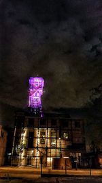 Low angle view of illuminated building at night