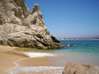 Scenic view of beach against clear sky