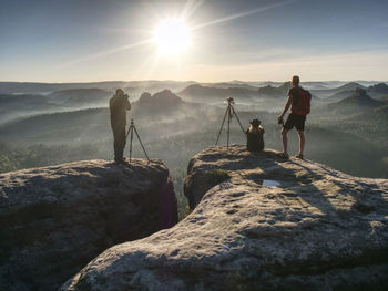Natur photographers on trail with tripod and backpack. popular place for workshops and sharing ideas