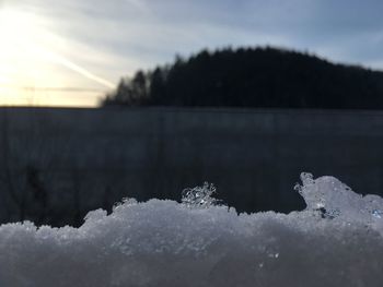 Scenic view of frozen lake against sky