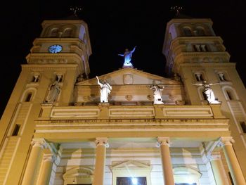 Low angle view of statue of building at night