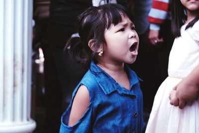 Girl shouting at social gathering