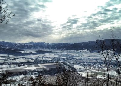 Scenic view of mountains against sky during winter