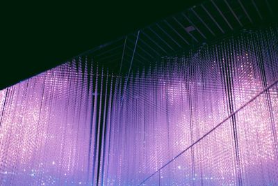 Low angle view of illuminated lights on ceiling