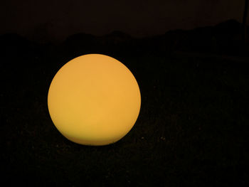 Close-up of orange over black background