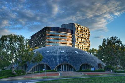 Low angle view of building against cloudy sky