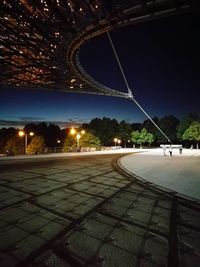 Illuminated bridge at night