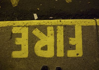 High angle view of arrow sign on street