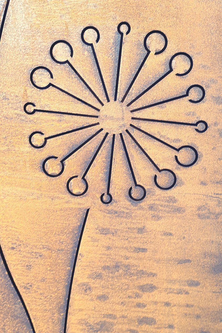 CLOSE-UP OF CLOCK ON TABLE AGAINST WALL