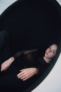 Portrait of young woman lying down